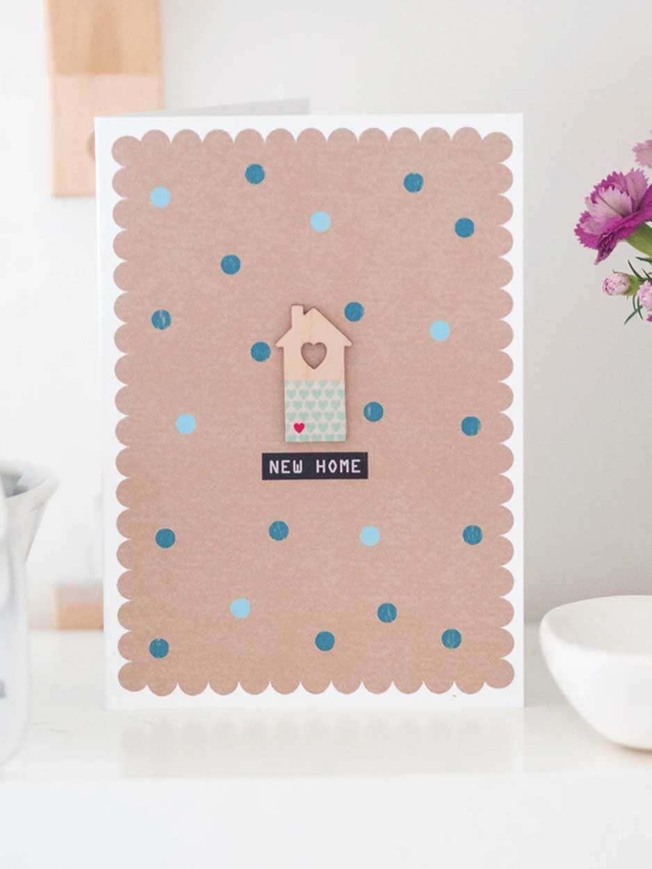 New Home Card With Wooden House Decoration